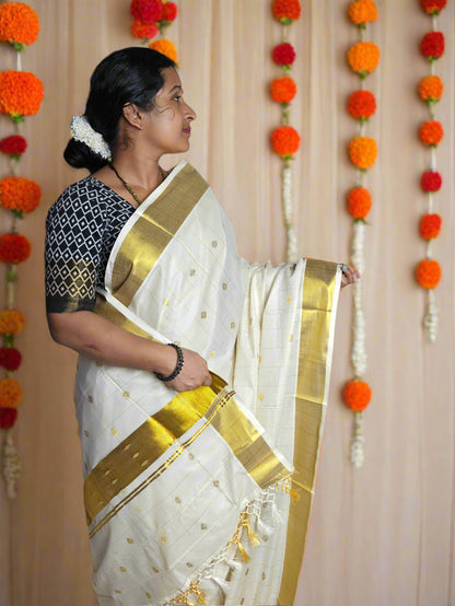 KERALA TISSUE KASAVU SAREE WITH ALL-OVER ZARI MOTIFS AND GOLDEN BORDER