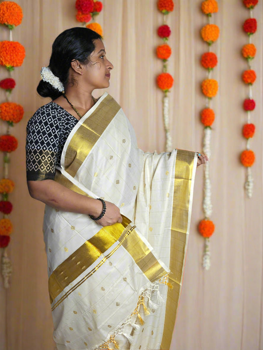 Kerala Tissue Kasavu Saree with All-Over Zari Motifs and Golden Border