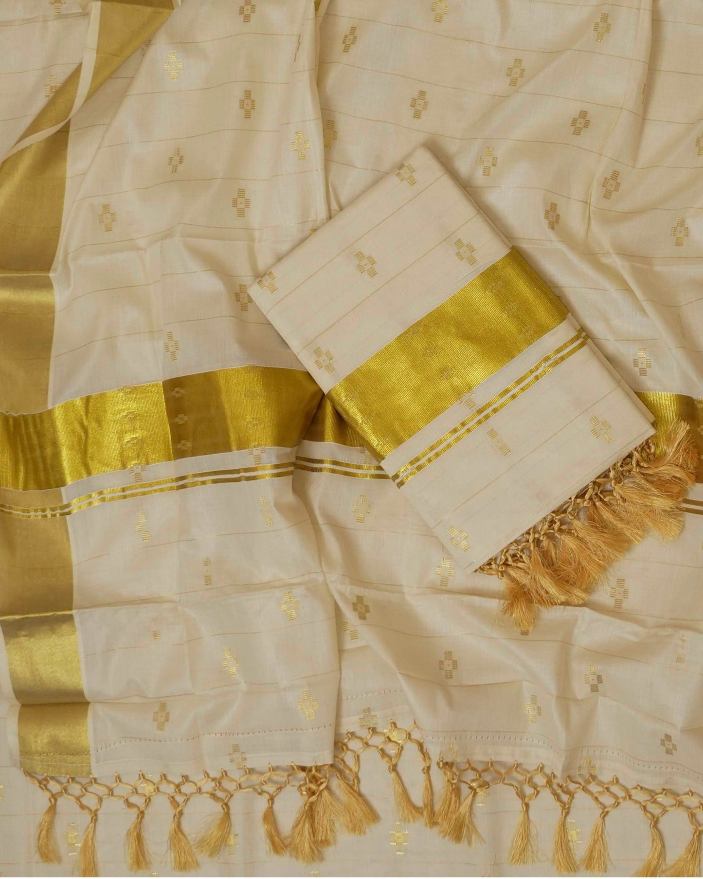 KERALA TISSUE KASAVU SAREE WITH ALL-OVER ZARI MOTIFS AND GOLDEN BORDER